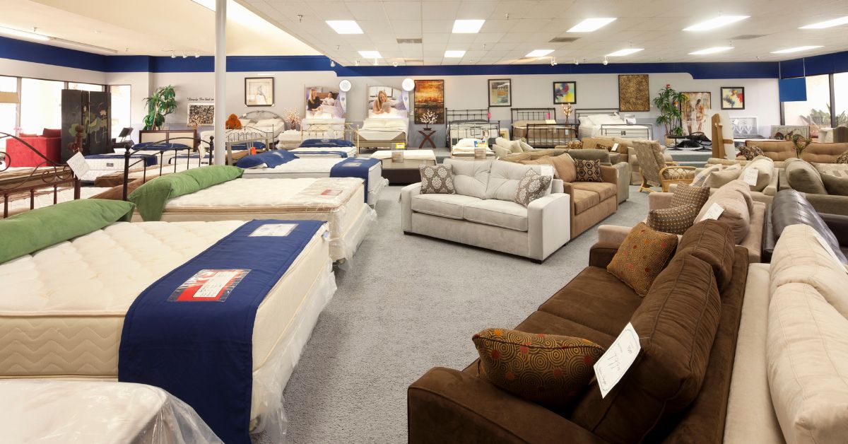 Furniture retail showroom displaying mattresses, sofas and home furnishings