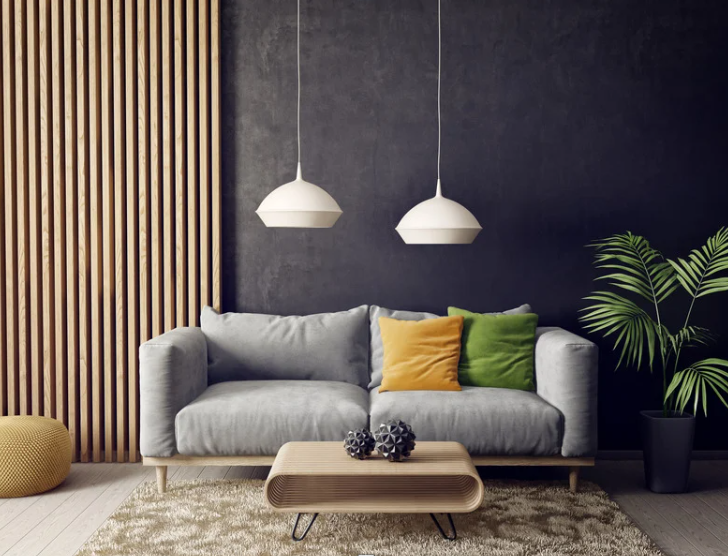 Modern living room with gray sofa, wooden slat wall, and white pendant lights - representing the furniture retailer from our case study about optimizing app download conversions