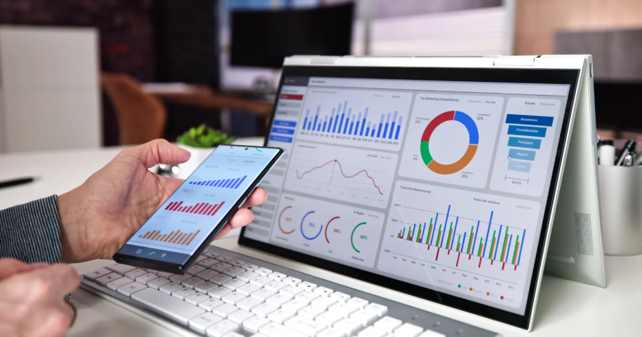 Professional CRO analyst reviewing conversion rate optimization analytics and A/B testing results on multiple devices to track website performance improvements